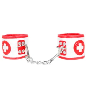 Cătușe sexy asistentă KINK Mini Nurse Wrist Restraints. pentru jocuri erotice. mărime ajustabilă. culoare alb cu roșu