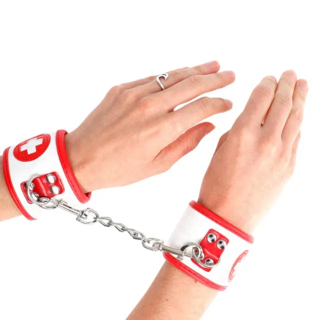 Cătușe sexy asistentă KINK Mini Nurse Wrist Restraints. pentru jocuri erotice. mărime ajustabilă. culoare alb cu roșu